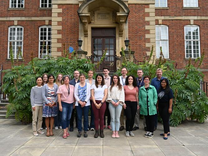 The Maiden Lab Group, June 2022. The group has around 20 members and is stood in front of the Sir William Dunn School of Pathology, Oxford, the building in which we are based. 